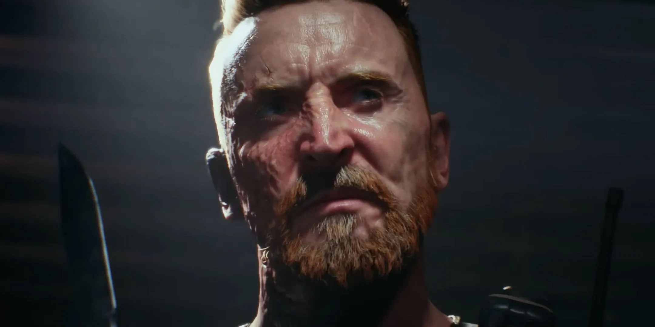 Người lính Battlefield 6 với khuôn mặt cháy sém cầm dao, thể hiện sự khắc nghiệt của chiến trường.