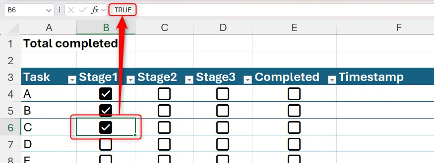 Một ô chứa checkbox được tích, giá trị Boolean TRUE hiển thị trên thanh công thức.