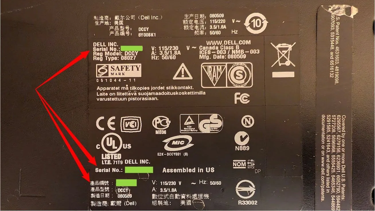 Sticker serial trên laptop cũ, vị trí thường thấy khi lật úp máy